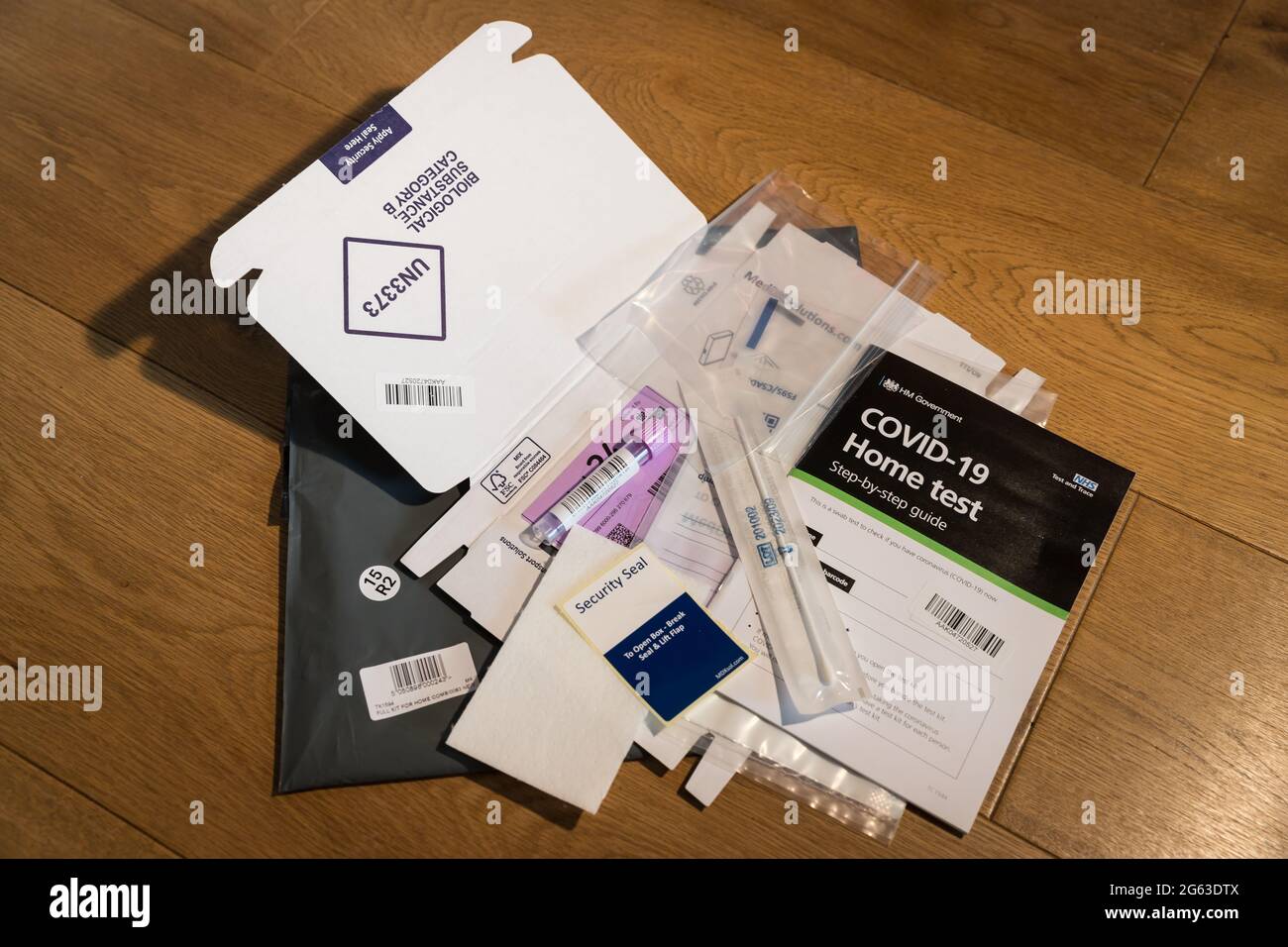 components of the NHS issued covid PCR home test kit Stock Photo Alamy