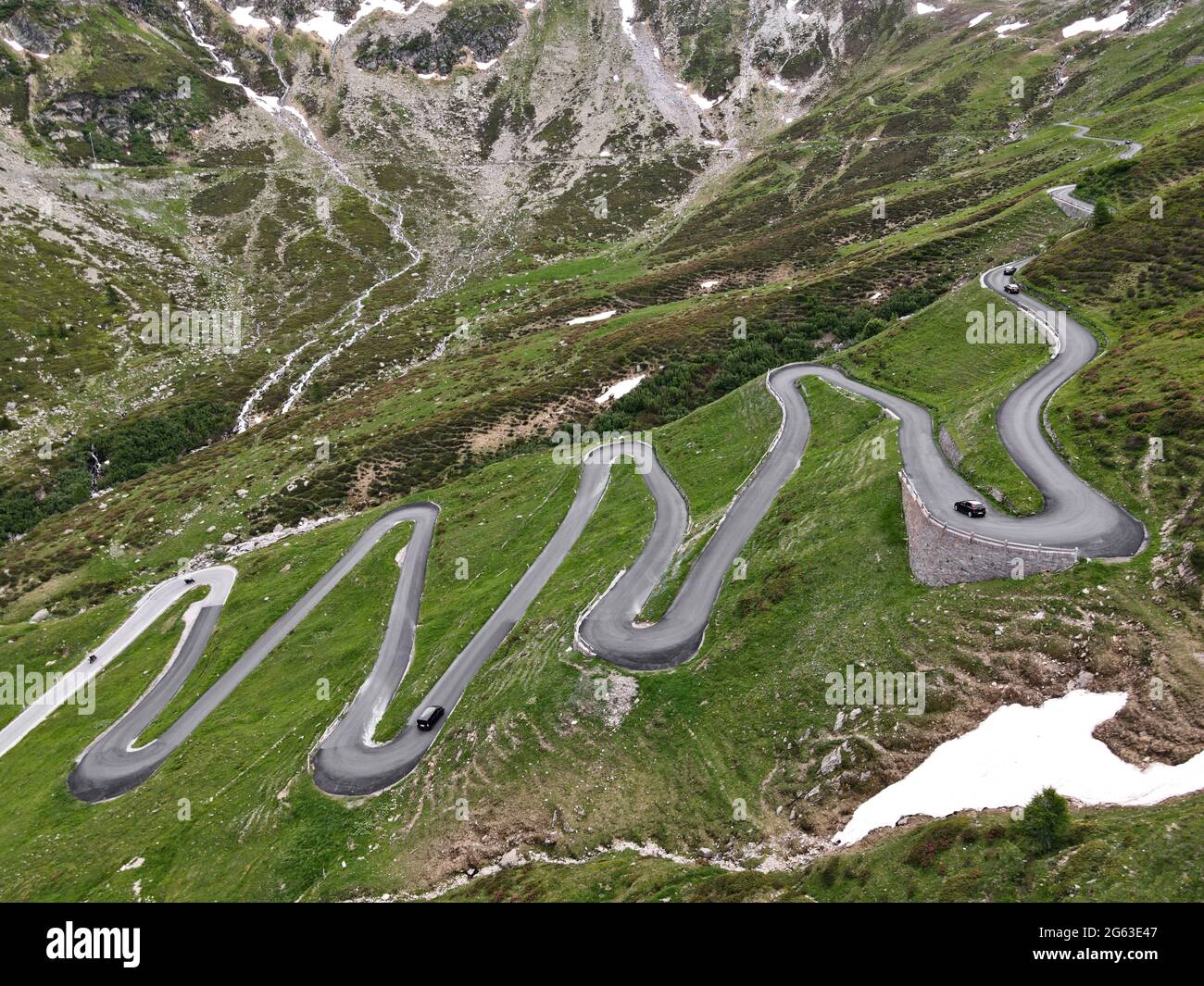 Aerial view of the serpentines on the north side of the Splügen Pass in the Swiss canton of Graubünden. Stock Photo
