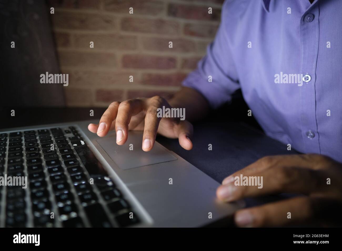 young man working on laptop stealing personal data  Stock Photo