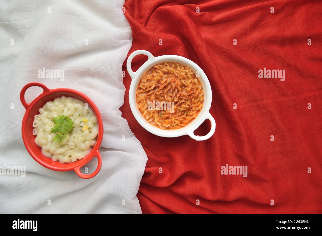 White Pasta in Red colored bowl on White background and Red Pasta in