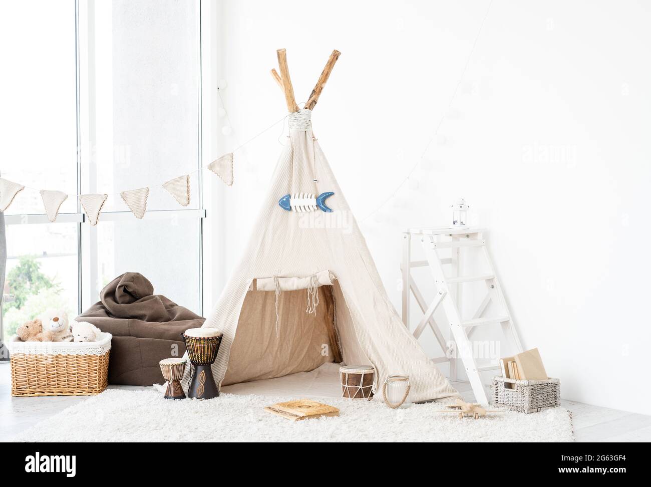 Kids room interior with wigwam, toys and djembe drums Stock Photo