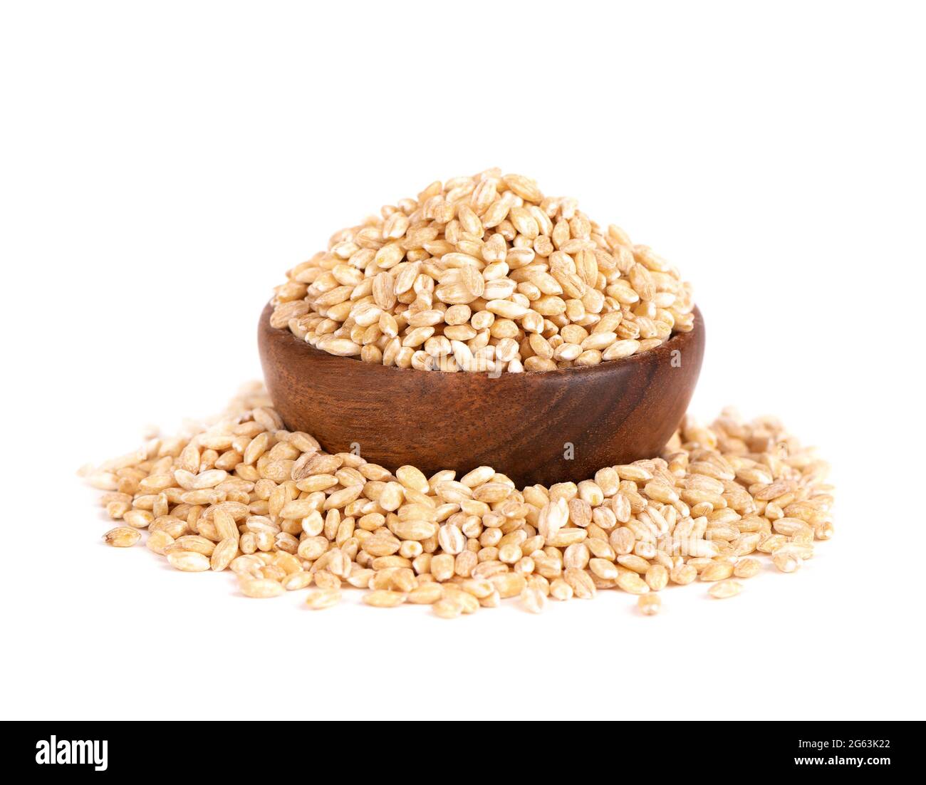 Pearl barley grains in wooden bowl, isolated on white background