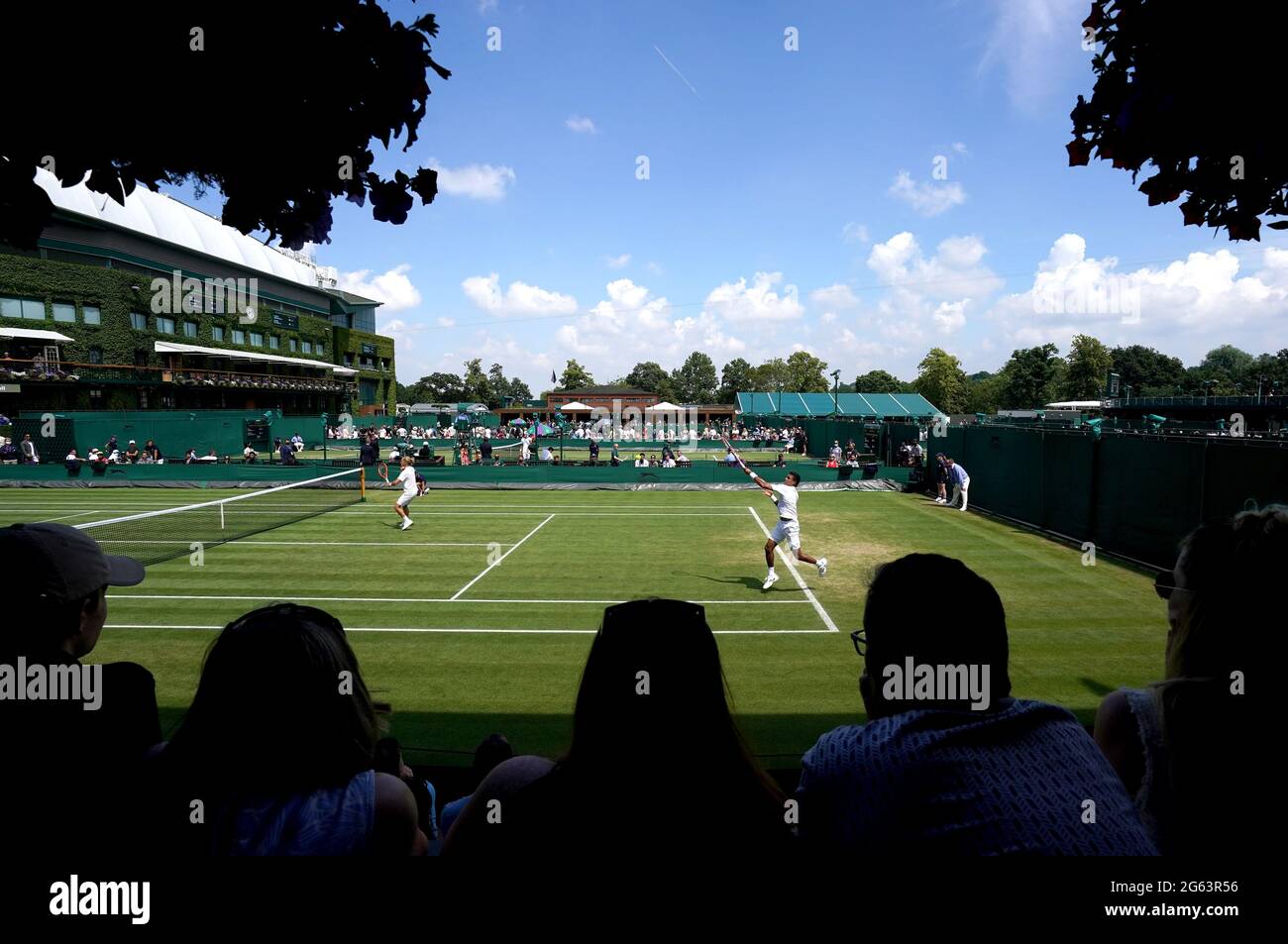 Fans watch the action on court four between Alexander Bublik and Aleksandr Nedovyesov take on Rafael Matos and Thiago Monteiro on day five of Wimbledon at The All England Lawn Tennis and Croquet Club, Wimbledon. Picture date: Friday July 2, 2021. Stock Photo