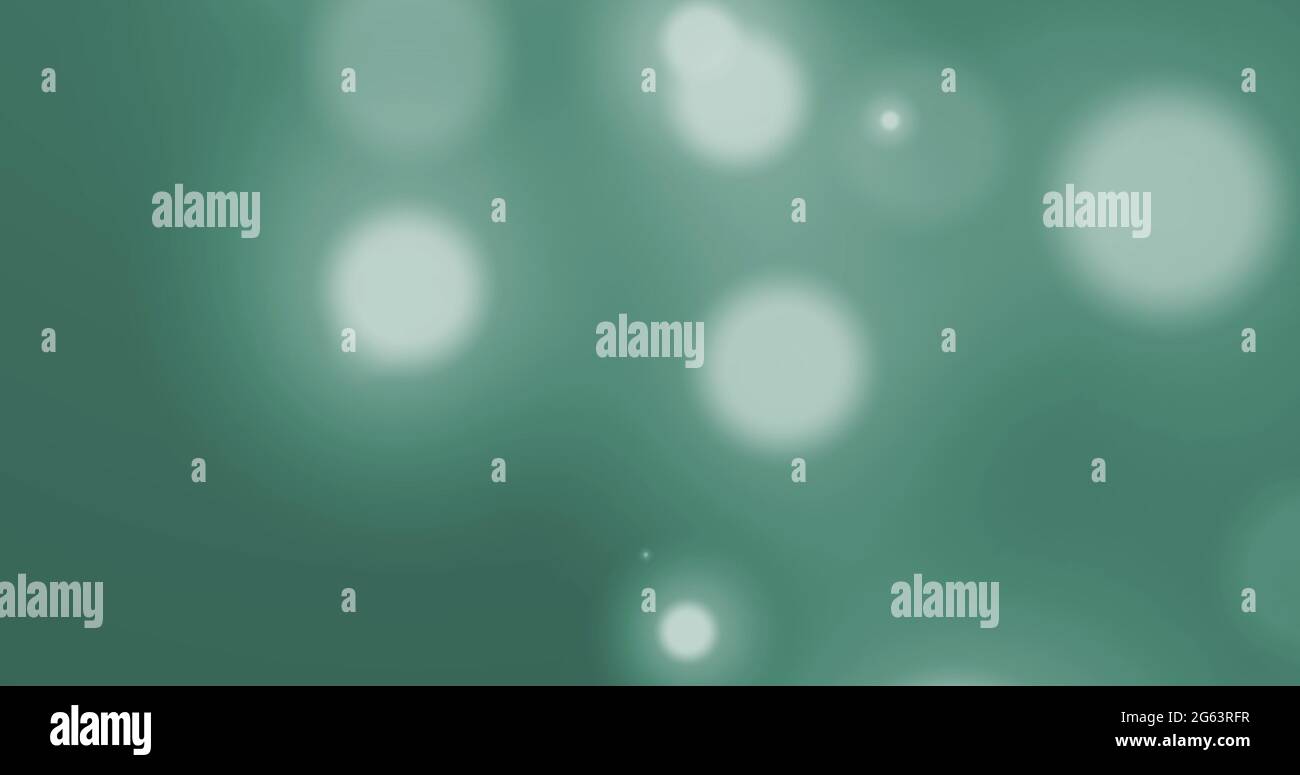 Image of glowing white spots of light moving in hypnotic motion on