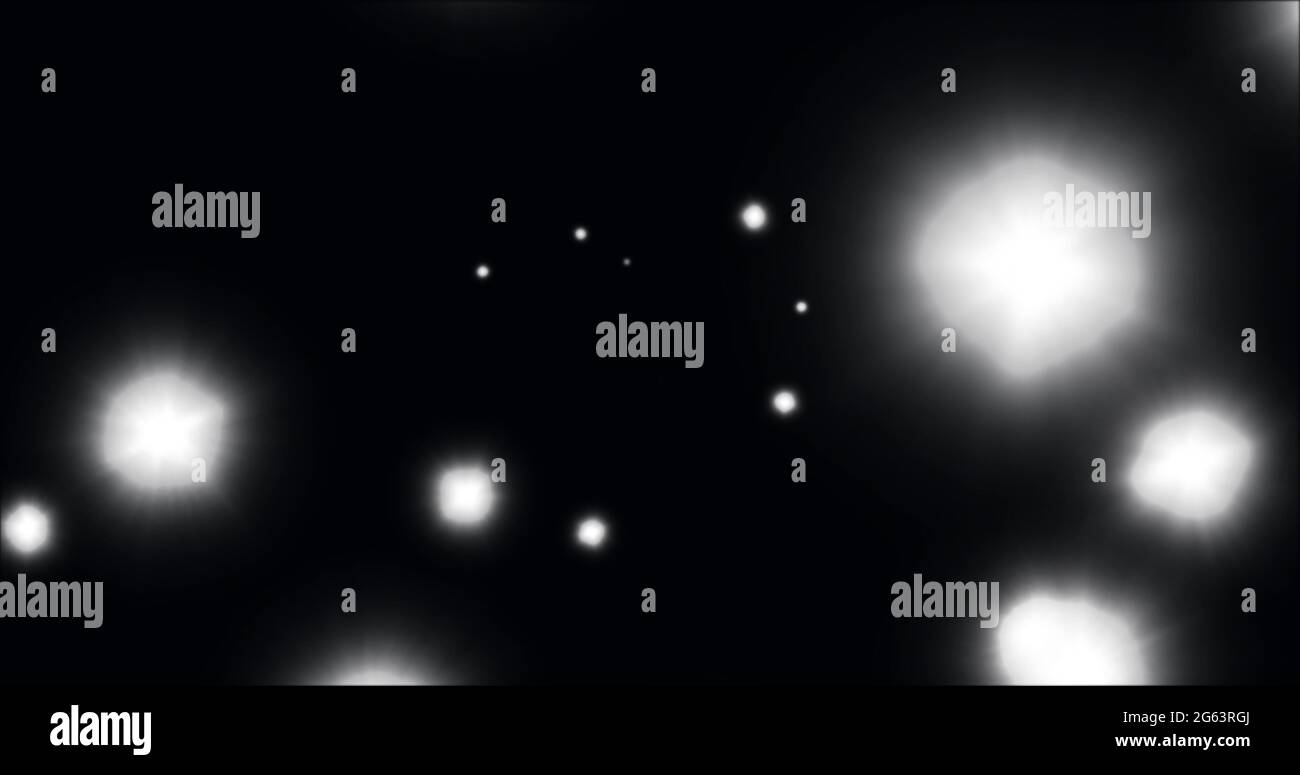 Image of glowing white spots of light moving in hypnotic motion on