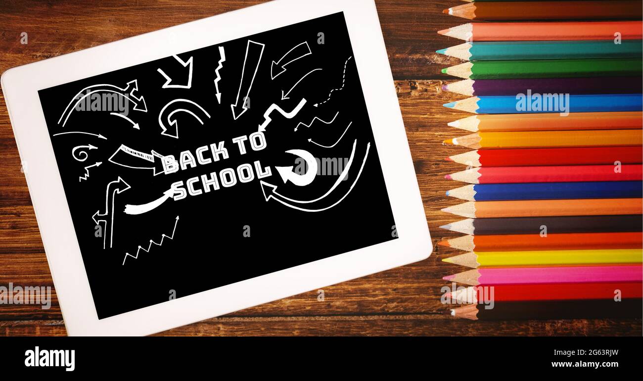 Composition of back to school text and pencil crayons Stock Photo