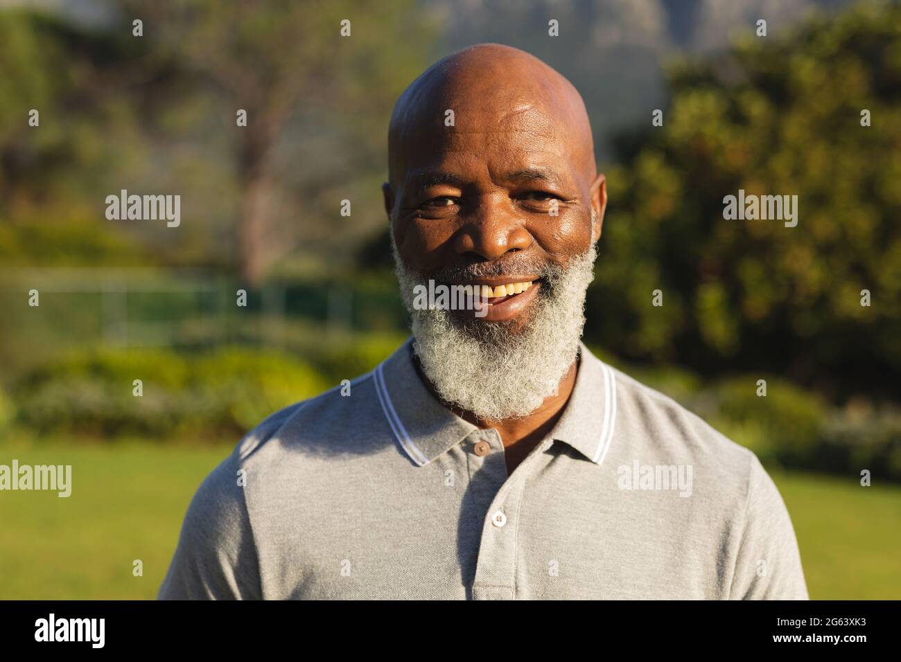 Portrait of smiling senior african american man in stunning countryside Stock Photo