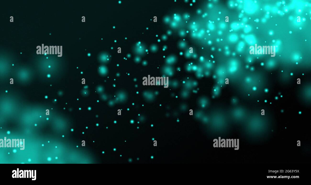 Glowing blue particles floating upwards on a dark background Stock ...