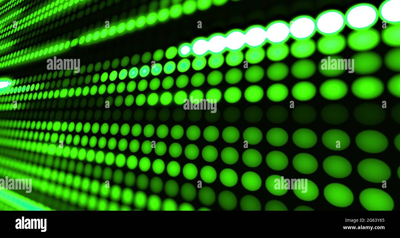 Rows of green led light diodes glowing and darkening on blakc background Stock Photo
