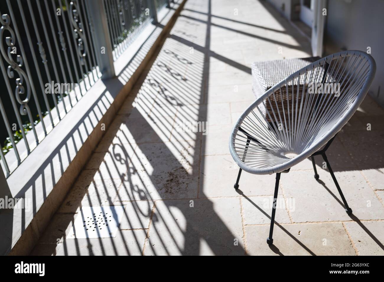 General view of round chair on a sunny balcony Stock Photo