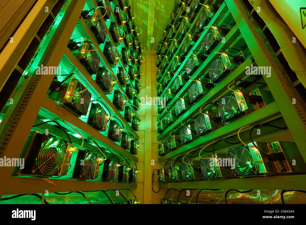 Bitcoin miners in large farm. ASIC mining equipment on stand racks mine  cryptocurrency in steel container. Blockchain techology application  specific Stock Photo - Alamy