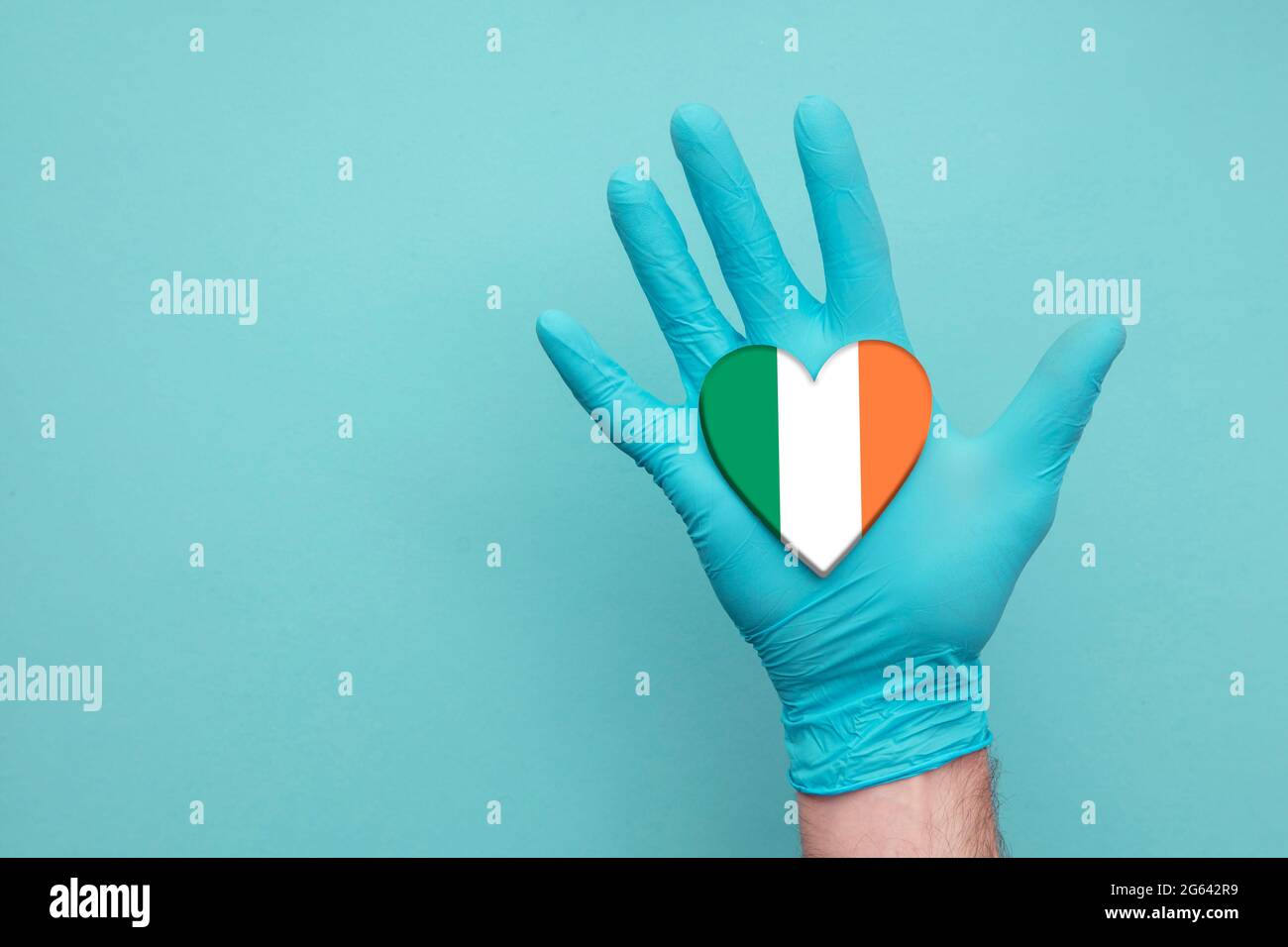 Ireland medical health heart. Nurse hand holding country heart flag Stock  Photo - Alamy