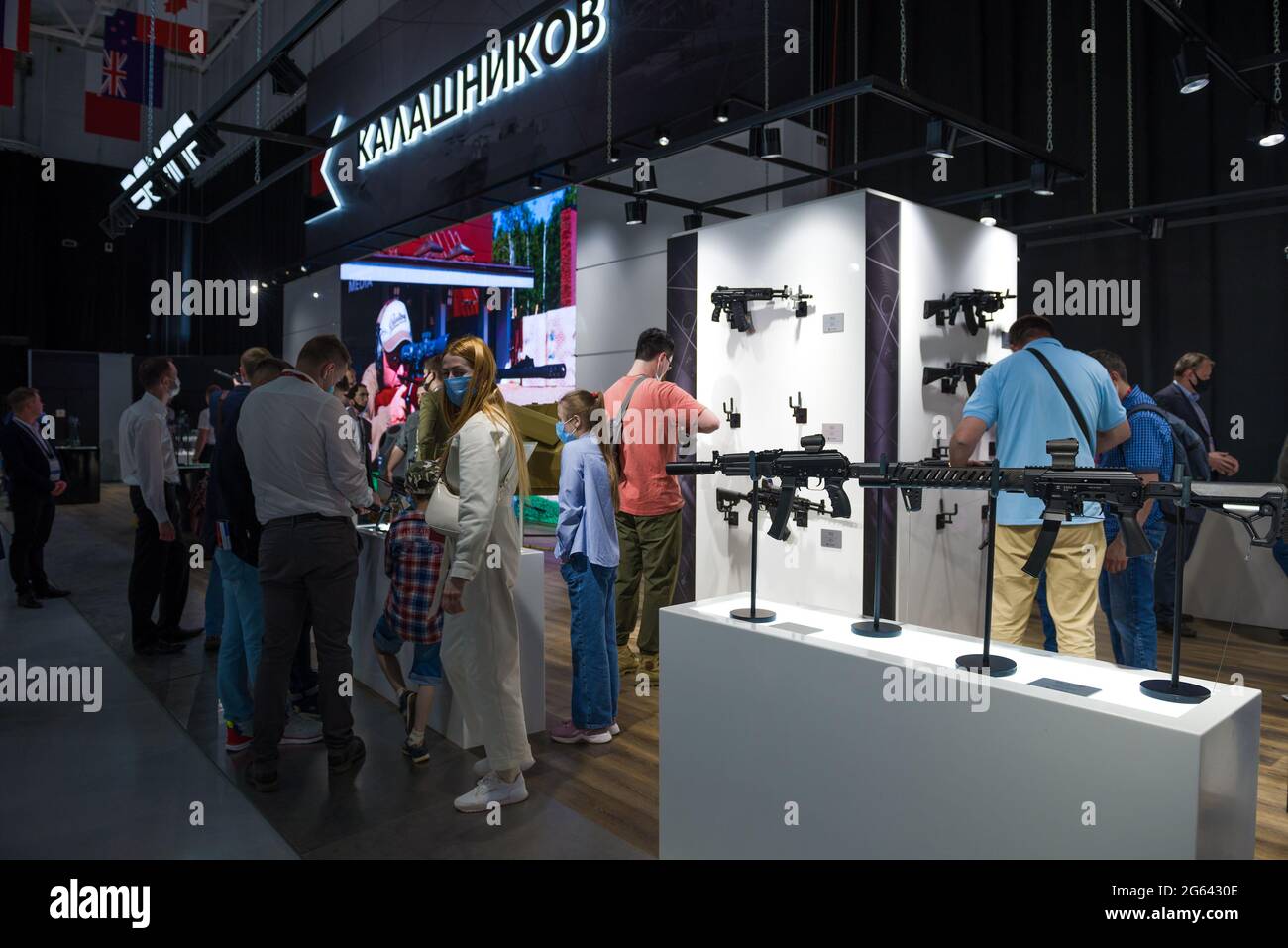 MOSCOW REGION, RUSSIA - AUGUST 25, 2019: Visitors view new small arms in the pavilion of the Kalashnikov concern. International military-technical for Stock Photo