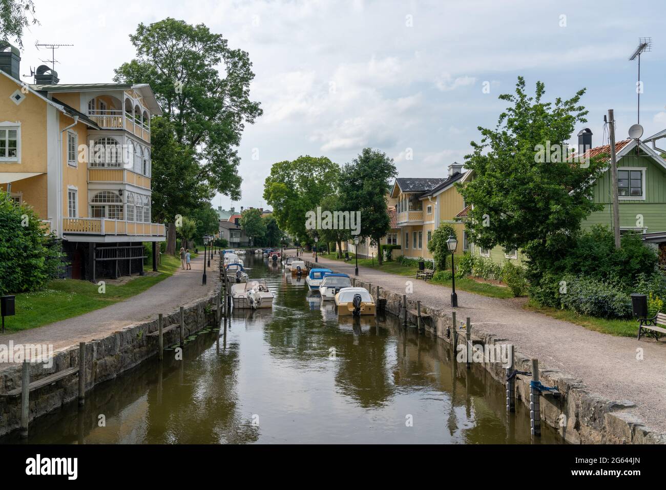 Trosa, Sweden - 22 June, 2021: many boats line the canals of the harbor front in the idyllic Swedish village of Trosa Stock Photo