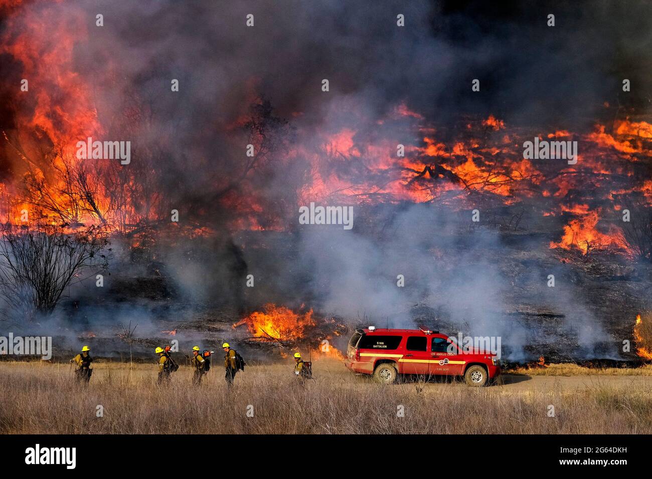 Irwindale, California, USA. 15th June, 2021. Firefighters battle brush fire burning in the Santa Fe Dam Recreation Area. Credit: Ringo Chiu/ZUMA Wire/Alamy Live News Stock Photo