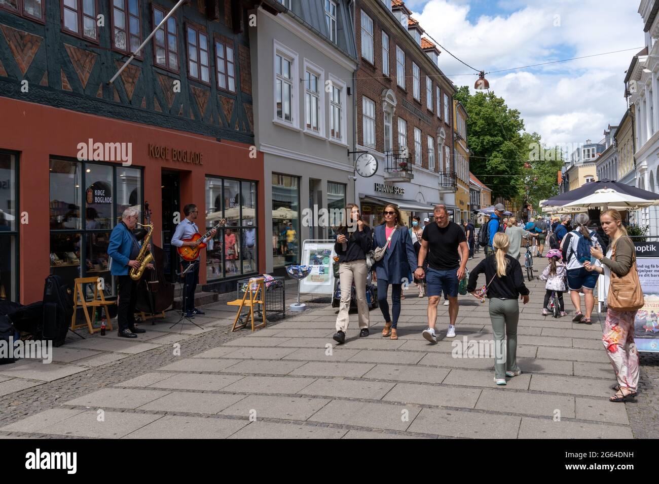Festival Swipe Athletic Koge, Denmark - 12 June, 2021- busy high street on a beautiful summer day  in Koge with a jazz band playing and many people walking by and enjoying  the Stock Photo - Alamy