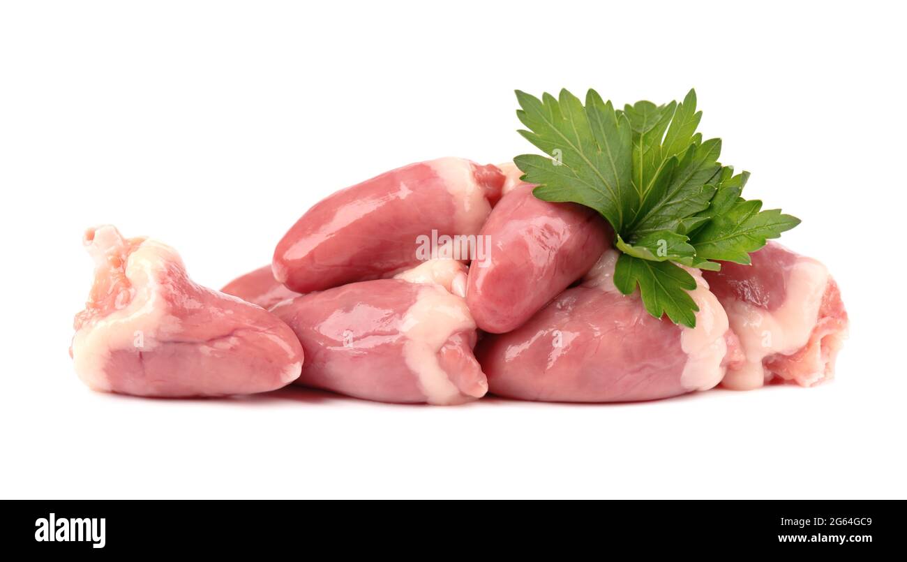 Chicken hearts raw isolated on white background. Fresh chicken broiler hearts with parsley leaves. Close up. Stock Photo