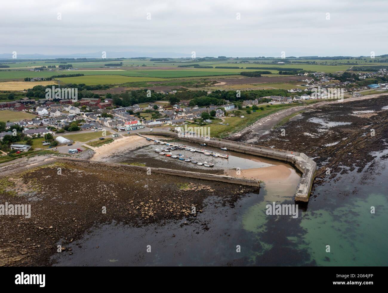 Aerial view of Balintore harbour and seaboard villages of Shandwick and Balintore, Easter Ross, Scotland. Stock Photo