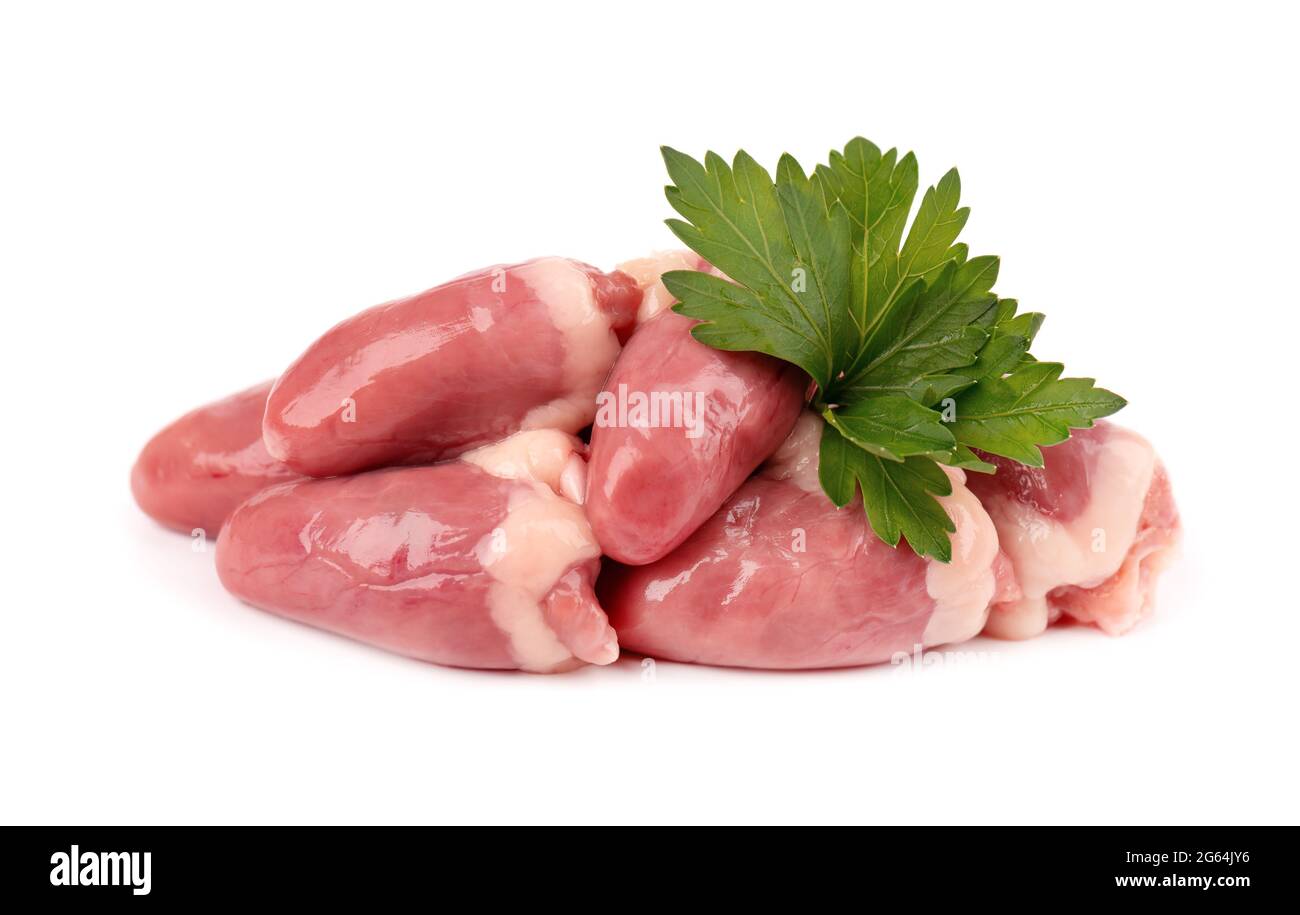 Chicken hearts raw isolated on white background. Fresh chicken broiler hearts with parsley leaves. Close up. Stock Photo