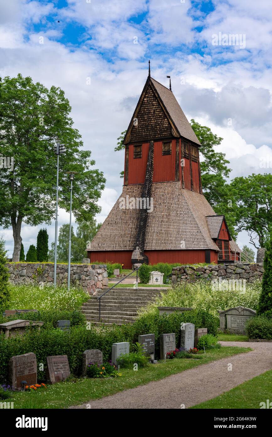Gamla Uppsala, Sweden - 24 June, 2021: the historic old church in Gamla Uppsala with the cemetery in the foreground Stock Photo