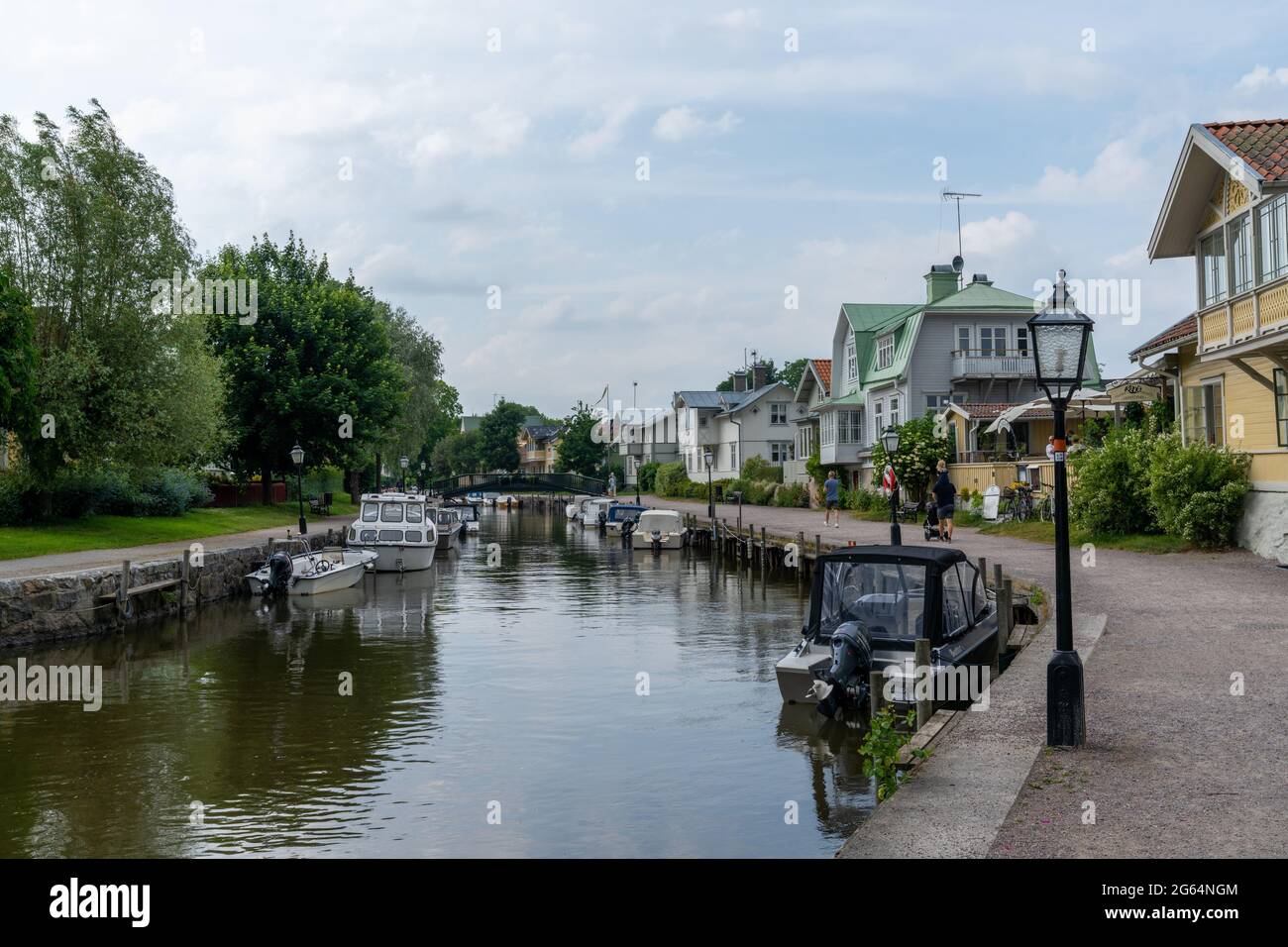 Trosa, Sweden - 22 June, 2021: many boats line the canals of the harbor front in the idyllic Swedish village of Trosa Stock Photo