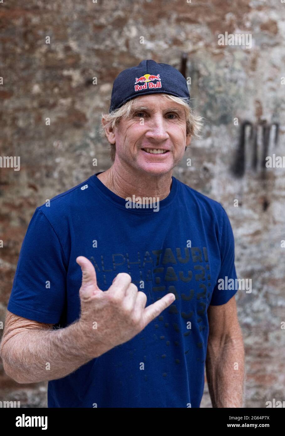 Hamburg, Germany. 02nd July, 2021. Robert 'Robby' Staunton Naish, American surfer and multiple world champion in windsurfing, stands for the presentation of the film 'The Longest Wave' at the Zeise Kino in Hamburg. Credit: Markus Scholz/dpa/Alamy Live News Stock Photo