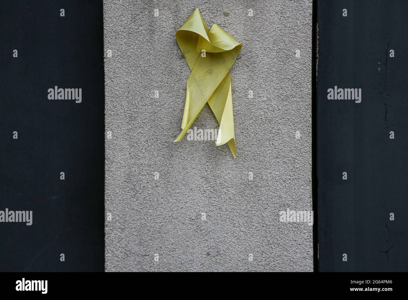 A yellow ribbon is placed outside the house of former Philippine President Benigno Aquino III who died at the age of 61 in Manila, Philippines. Stock Photo