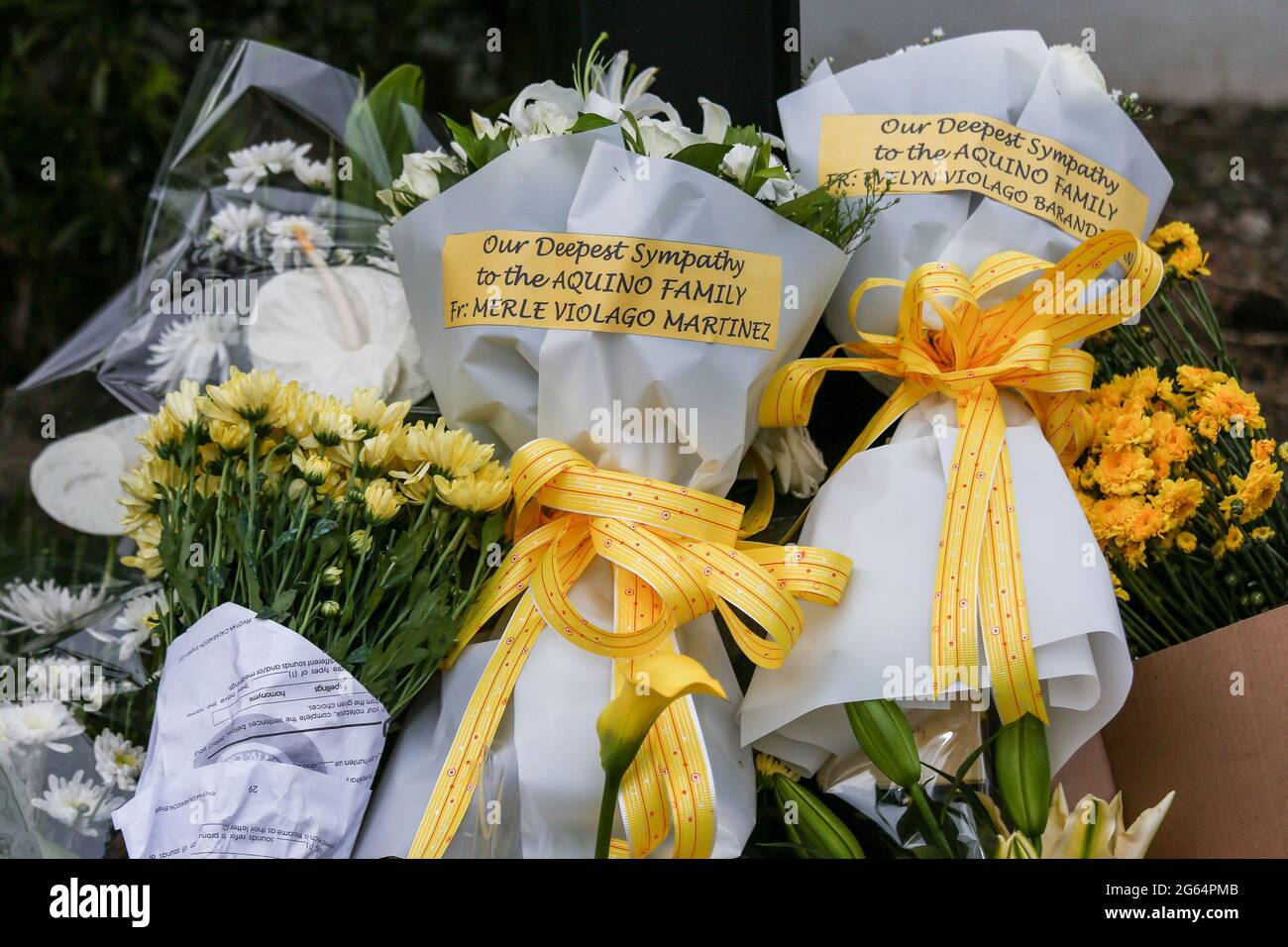 Flowers are placed outside the house of former Philippine President Benigno Aquino III who died at the age of 61 in Manila, Philippines. Stock Photo
