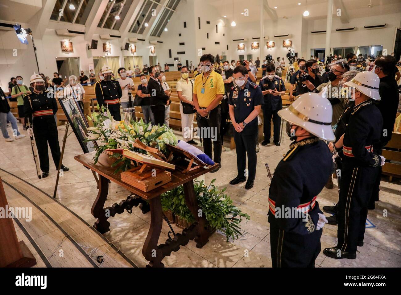 Police chief Guillermo Eleazar (middle right), offers prayer during the wake of former President Benigno Aquino III at the Ateneo Church of Gesu in Quezon City, Metro Manila, Philippines. Stock Photo