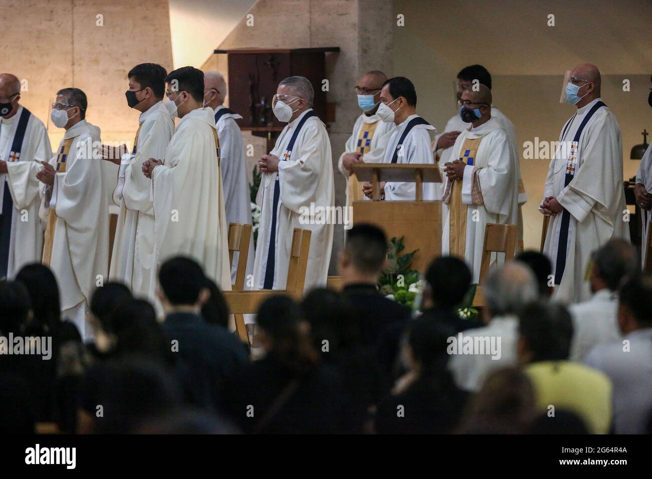 Catholic Priests Stand During A Concelebrated Mass Before The Burial Of ...