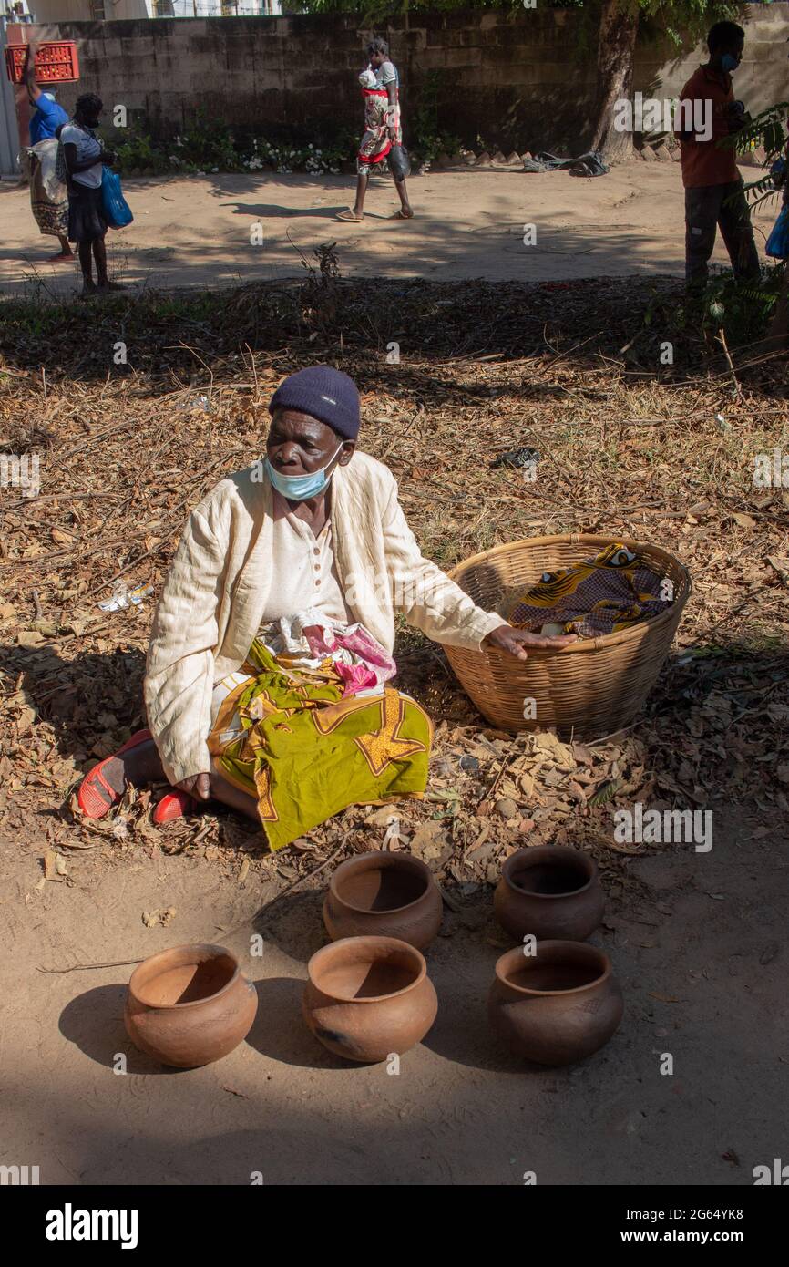 Woman selling handmade clay pots Stock Photo