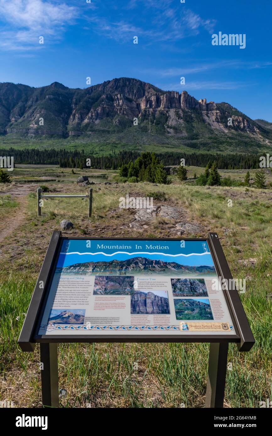Interpretive sign about Cathedral Rocks, result of an ancient rock avalanche, along Chief Joseph Scenic Byway, Shoshone National Forest, Wyoming, USA Stock Photo
