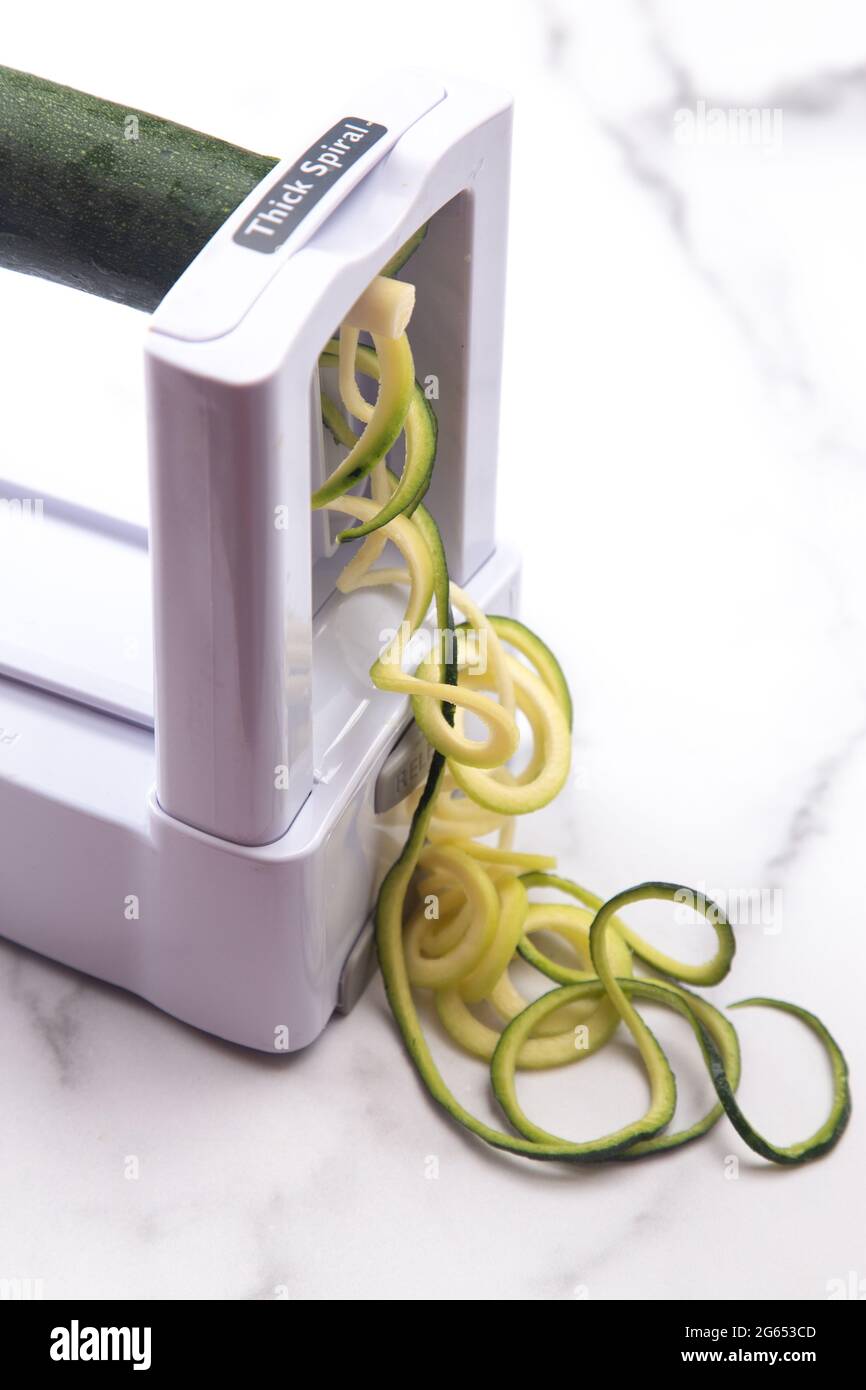 Zucchini Squash Being Cut into Pasta Like Twirls for a Healthy