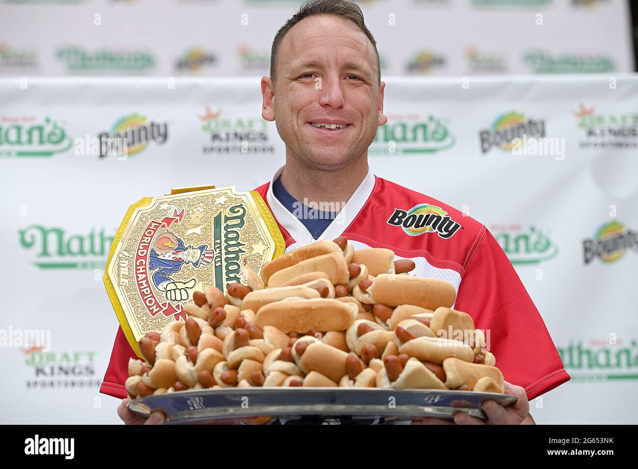 World record holder with 75 hot dogs (on tray) eaten in 10 minutes