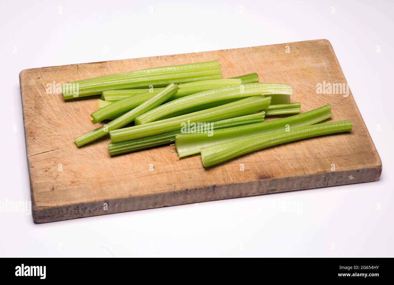 Celery sticks on a chopping board Stock Photo