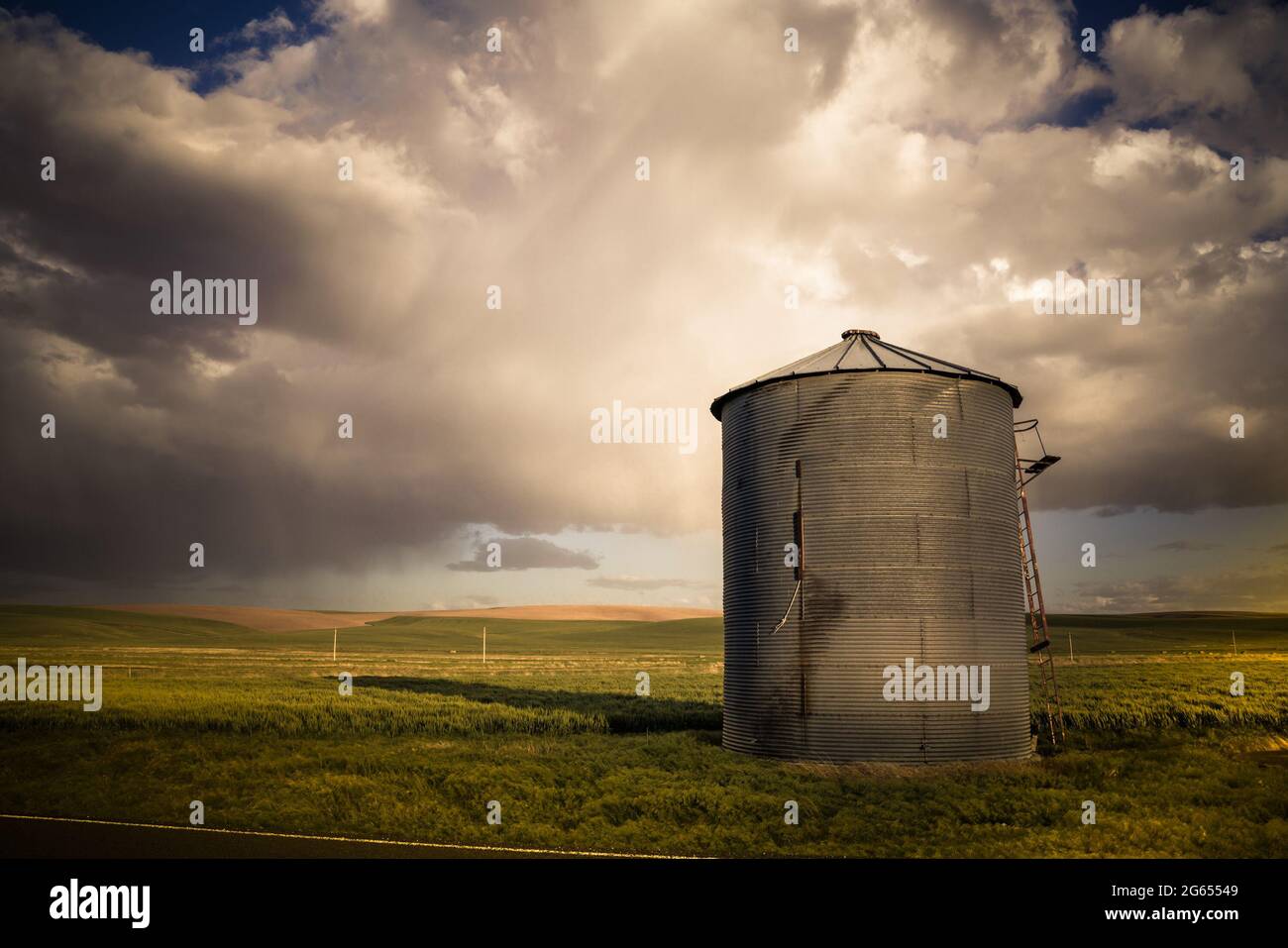 View of industrial grain silo from wheat farm in the Palouse Washington