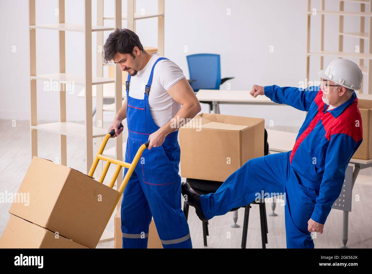 Two professional movers doing home relocation Stock Photo