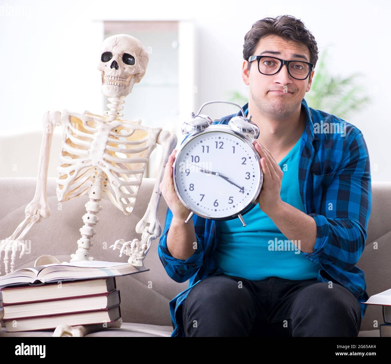 The student studying with skeleton preparing for exams Stock Photo