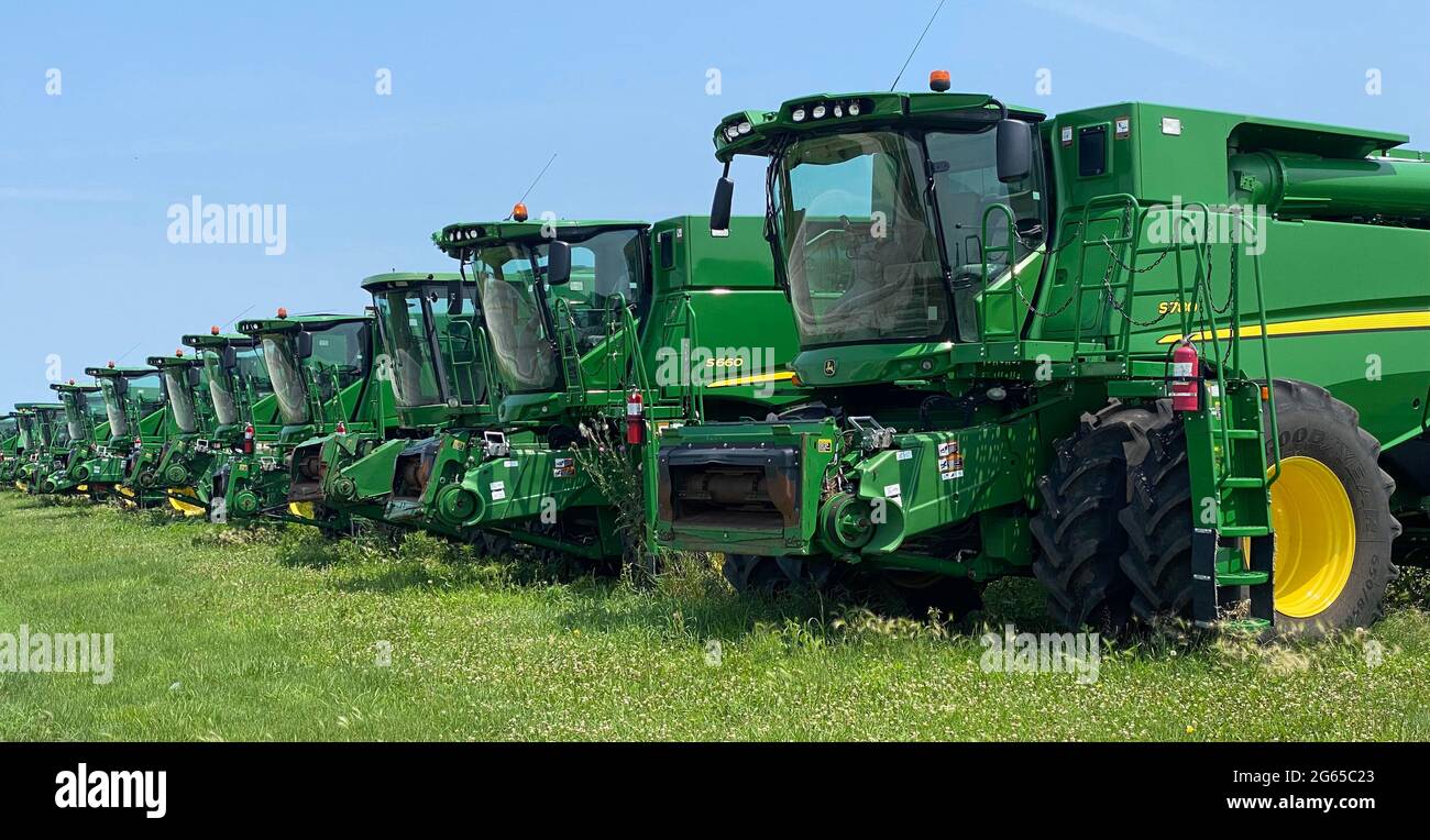 Avon, Illinois, USA. 2nd July, 2021. John Deere combine harvesters are