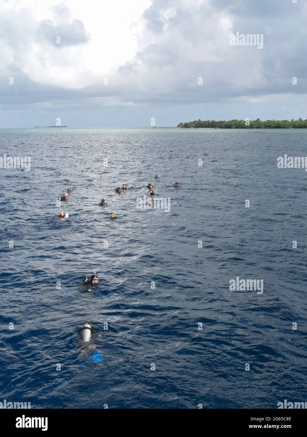 Scuba divers venture out to explore. Stock Photo