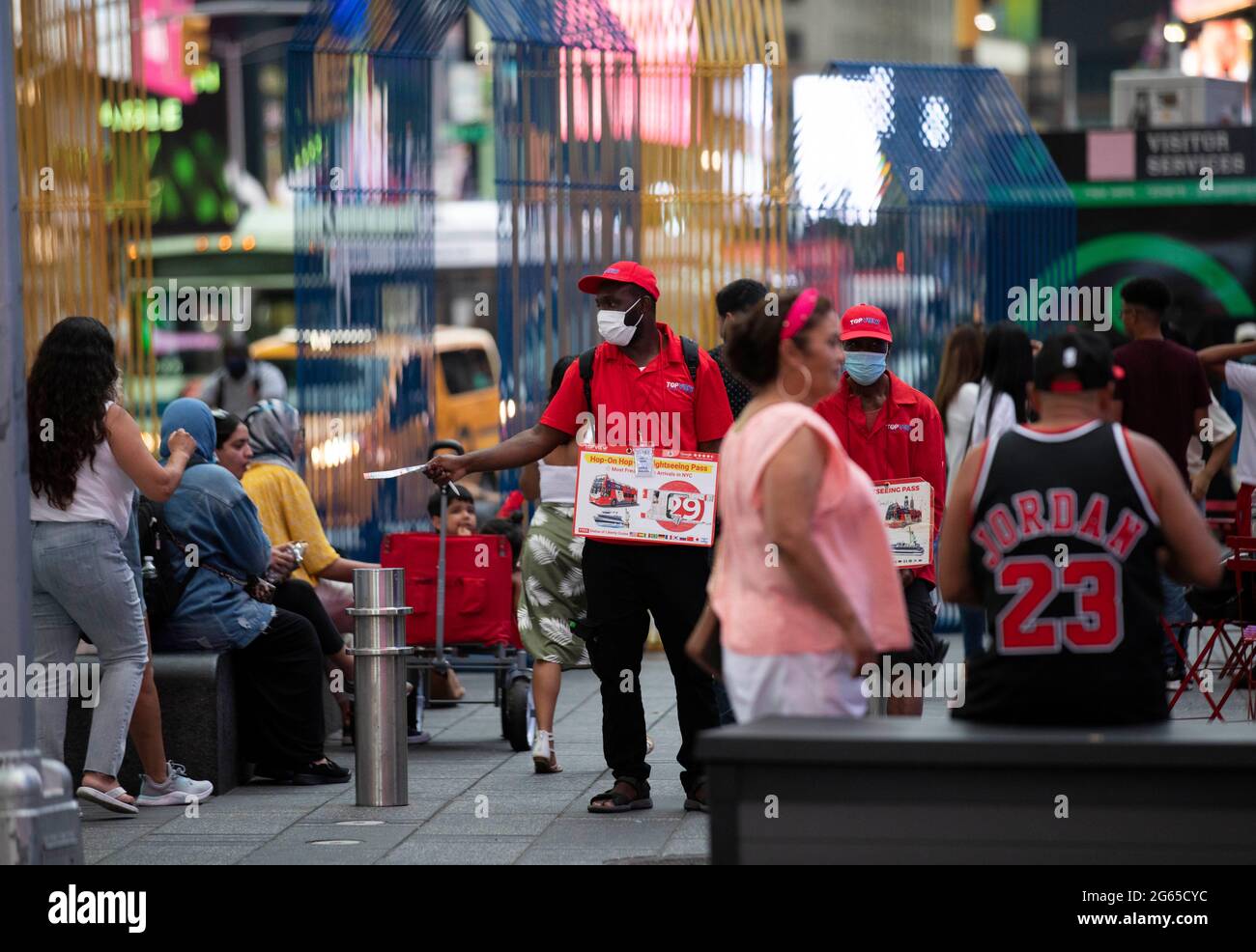 New York, USA. 2nd July, 2021. Sales persons for sightviewing buses work on  Times Square in New York, the United States, July 2, 2021. U.S. employers  added 850,000 jobs in June, with