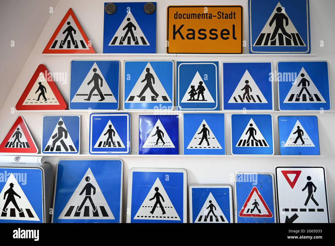 Kassel, Germany. 29th June, 2021. Various zebra crossing signs hang on