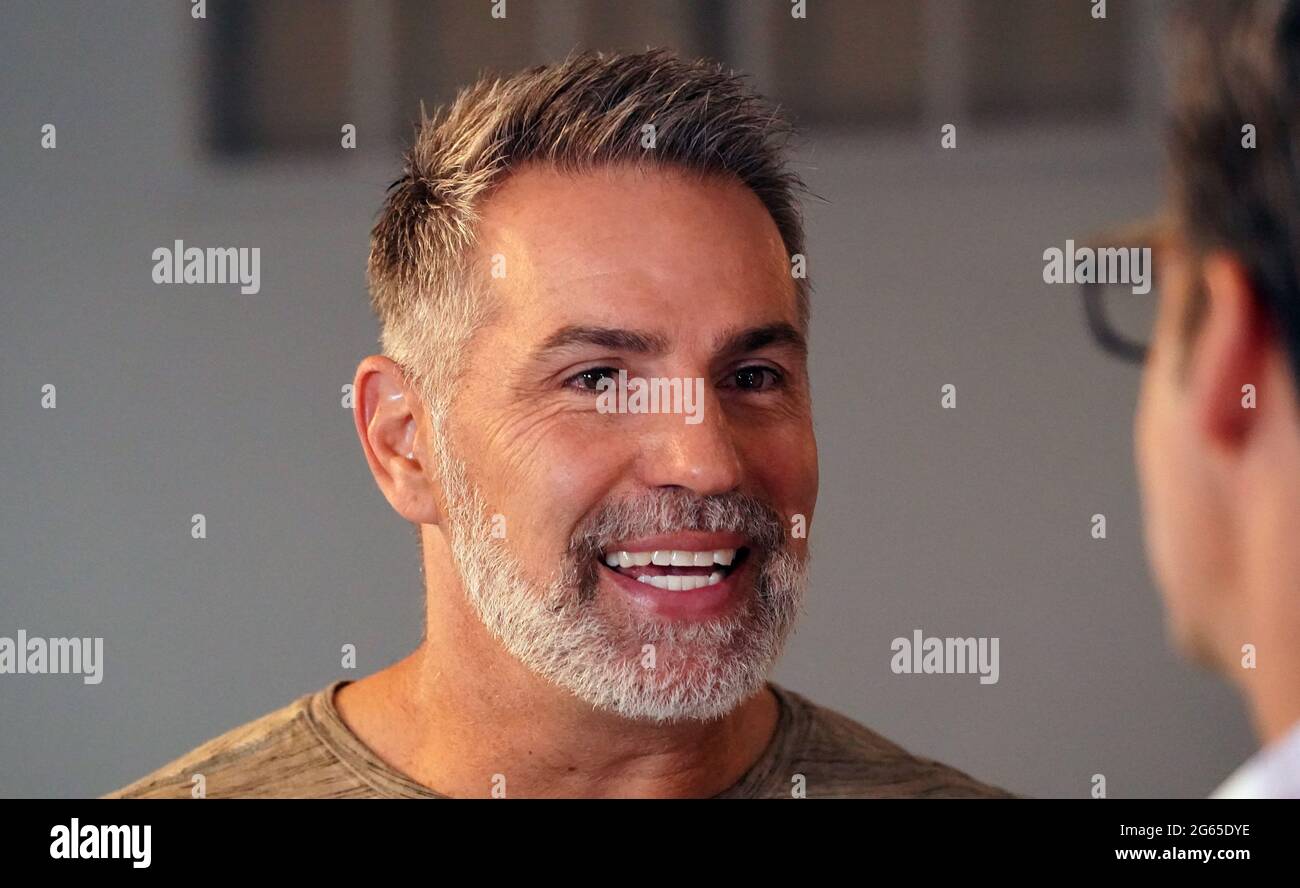 Alton, United States. 02nd July, 2021. Hall of Fame quarterback Kurt Warner,  and wife Brenda speak with reporters after surprising the Krikelas family,  with their new home in Alton, Illinois on Friday