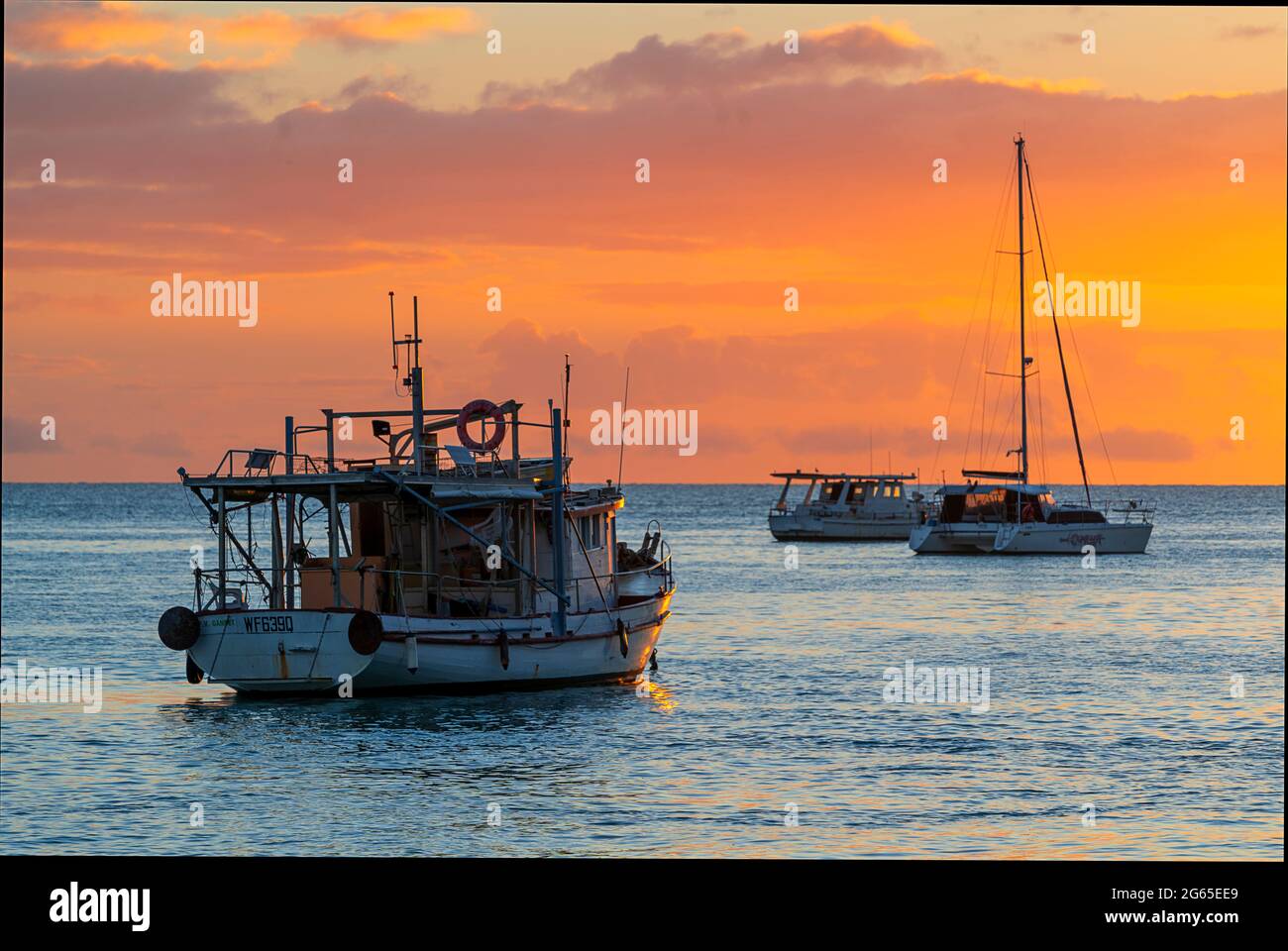 Fishing boats anchored in Burrum River at dawn. Burrum Heads, Queensland Australia Stock Photo