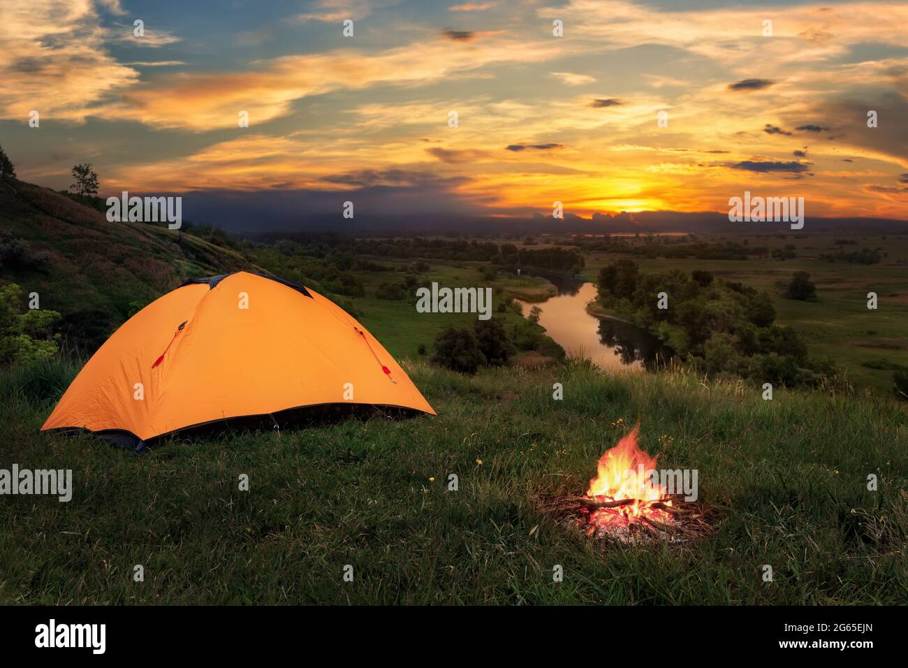 tourist tent on the hill near the river Stock Photo - Alamy