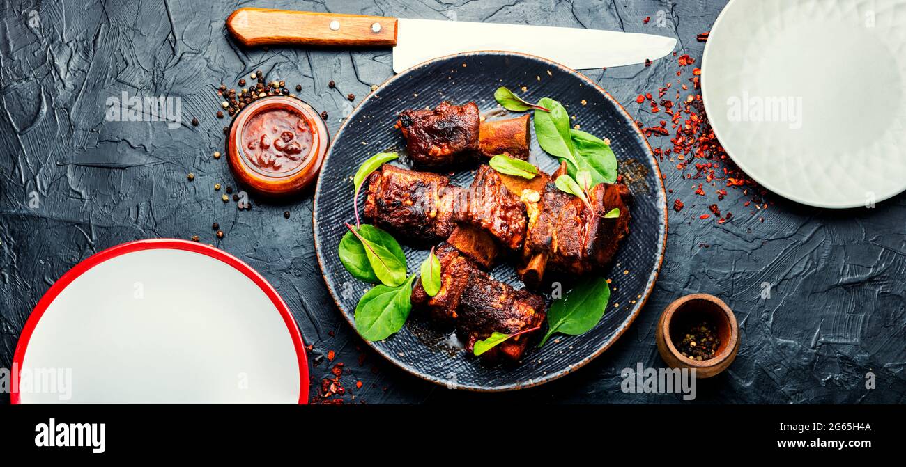 Piece of grilled beef ribs with a dark crust.American food,flat lay.BBQ beef rib Stock Photo