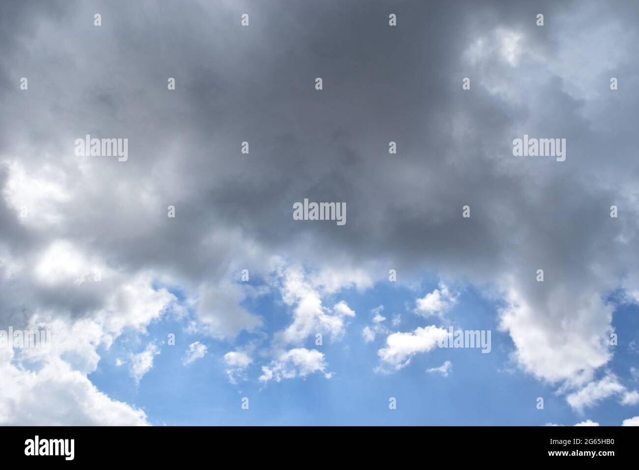 Cumulonimbus cloud formations on tropical sky , Nimbus moving , Abstract background from natural phenomenon and gray clouds hunk , Thailand Stock Photo