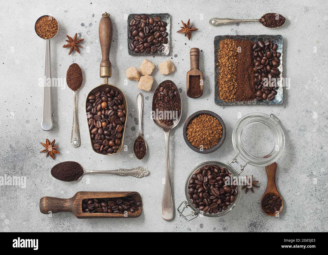 Freeze dried instant coffee granules with ground coffee and beans in