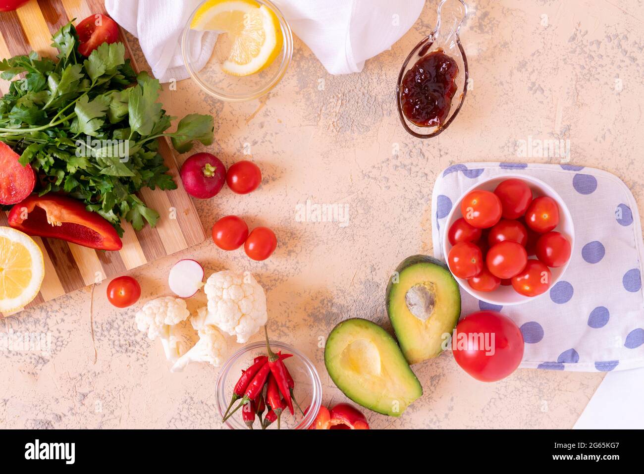 fresh sliced ingredients for detox sald, cut vegetables and fruits on the table Stock Photo