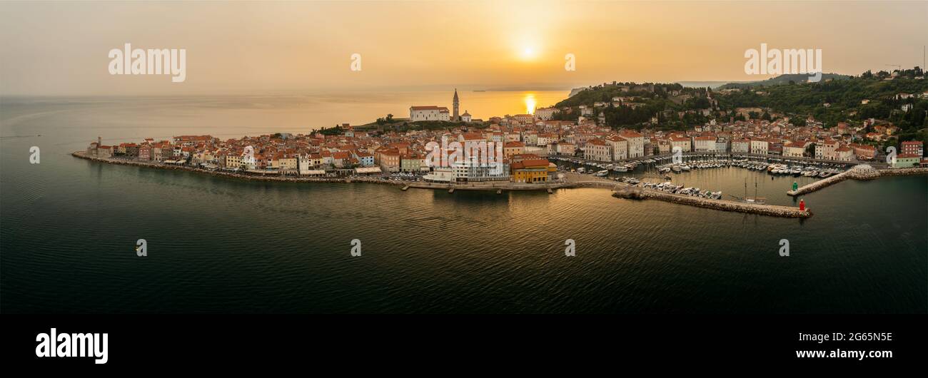 Unique panoramic photo about piran old town Slovenia. Amazing morning lighs on this full panorama photo what show everything of piran city Stock Photo